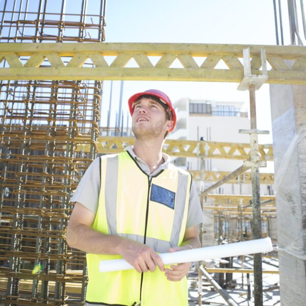 Construction worker looking at construction site